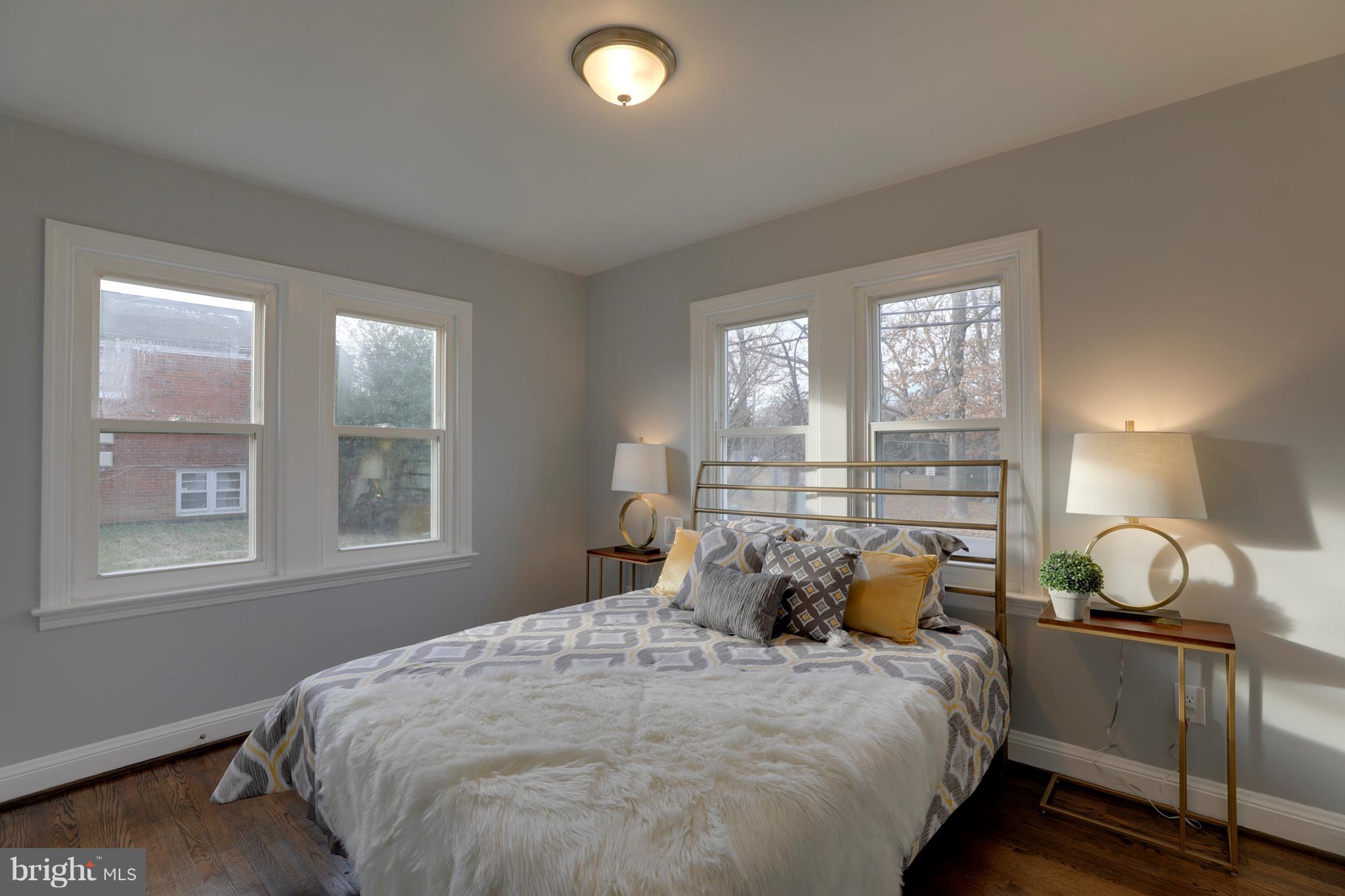 6203 Woodley Road Clinton, MD 20735 - Photo 16 of 38 a bedroom with a bed and window