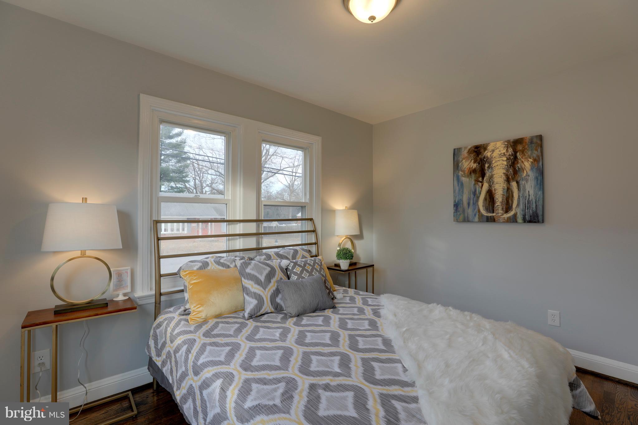 6203 Woodley Road Clinton, MD 20735 - Photo 18 of 38 a bedroom with a bed and window