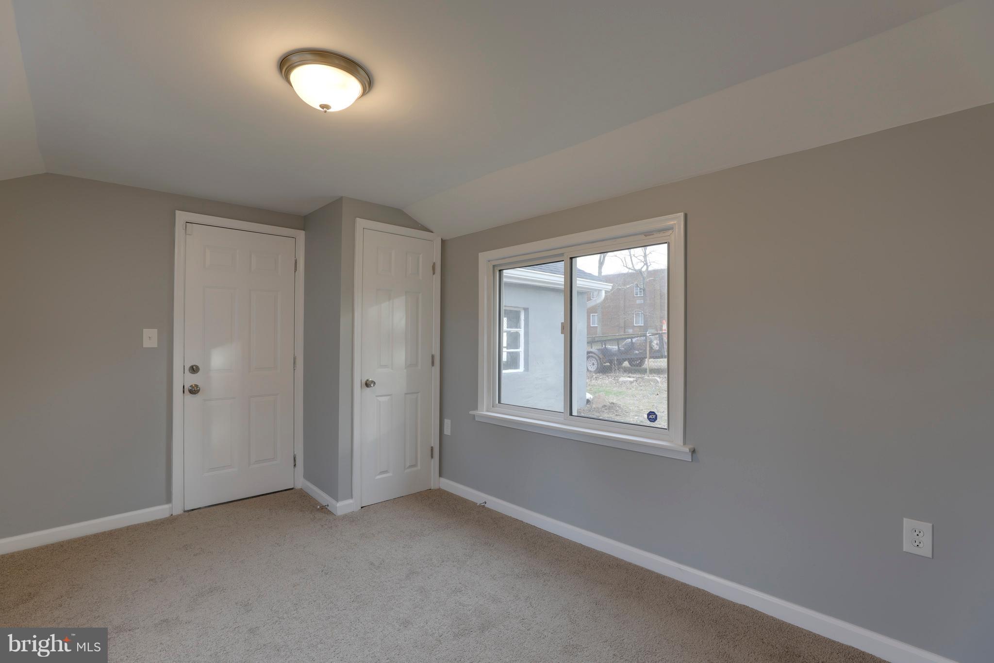 6203 Woodley Road Clinton, MD 20735 - Photo 24 of 38 an empty room with windows and closet