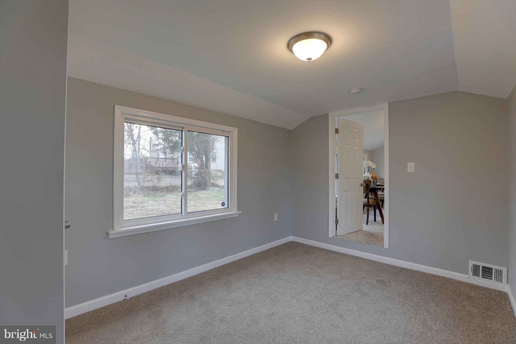 6203 Woodley Road Clinton, MD 20735 - Photo 25 of 38 an empty room with a window