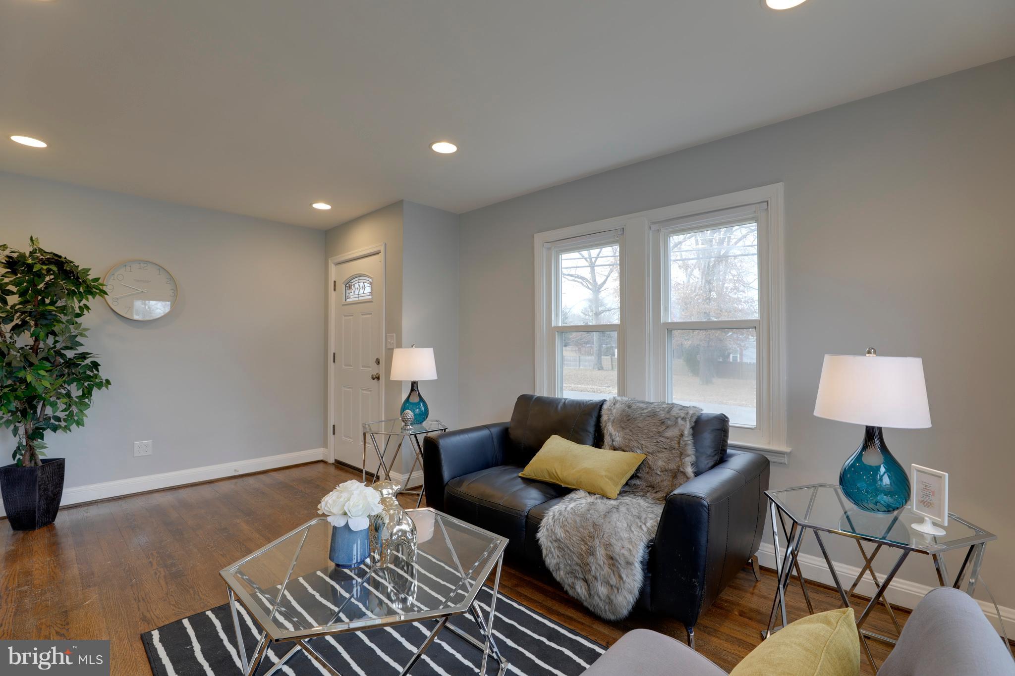 6203 Woodley Road Clinton, MD 20735 - Photo 4 of 38 a living room with furniture and a potted plant