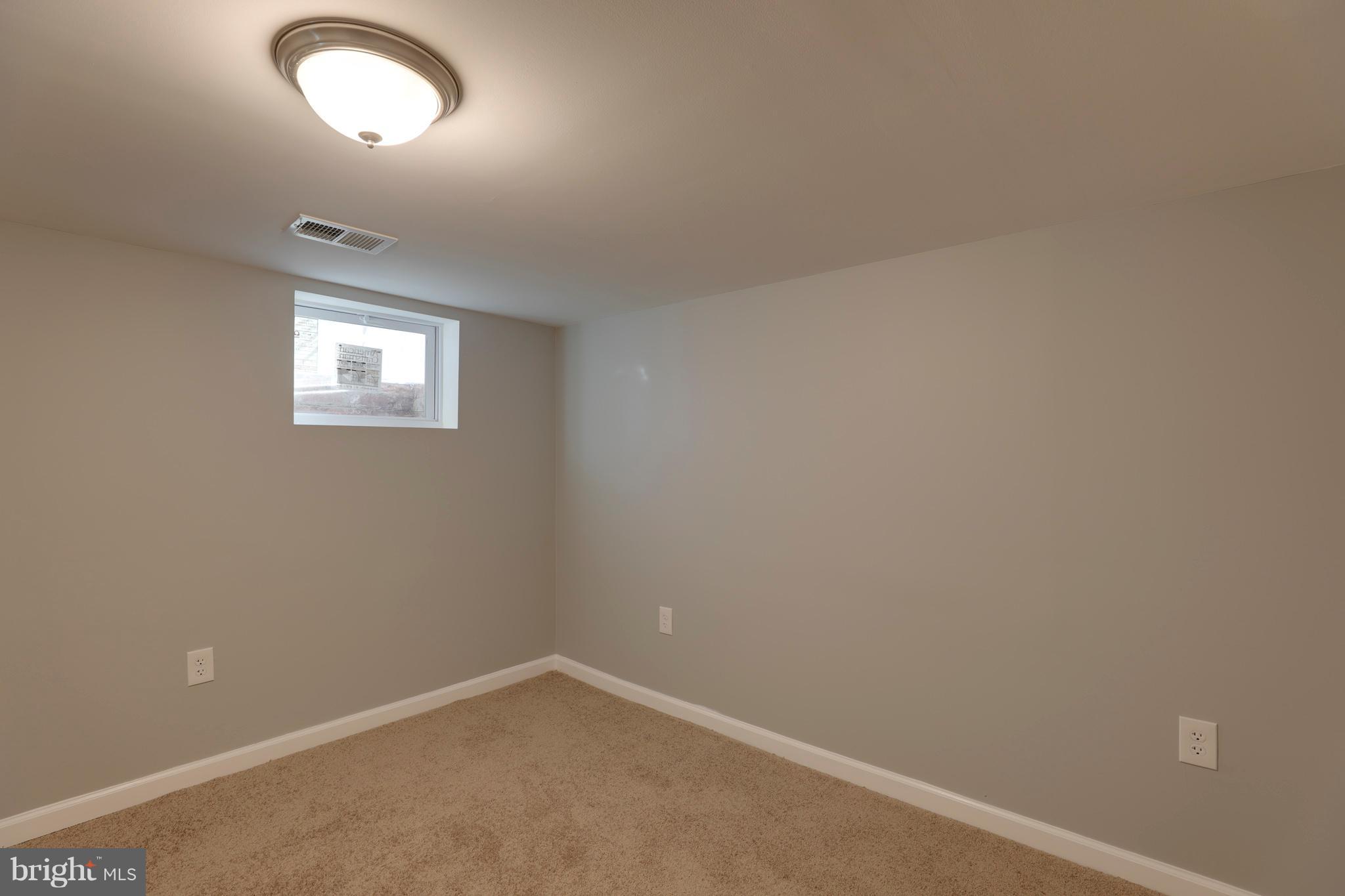 6203 Woodley Road Clinton, MD 20735 - Photo 34 of 38 an empty room with a window