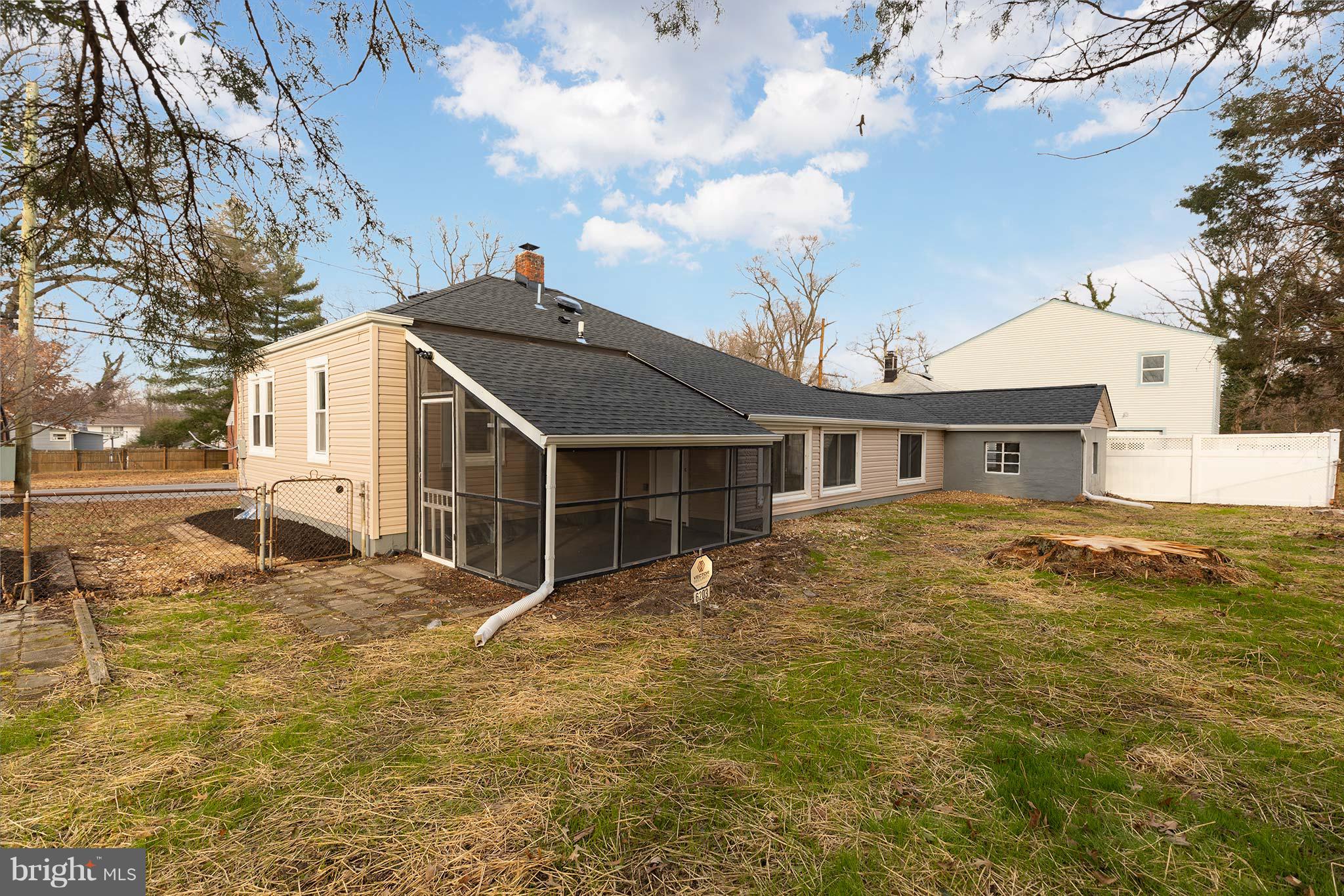 6203 Woodley Road Clinton, MD 20735 - Photo 36 of 38 a front view of a house with yard and garage
