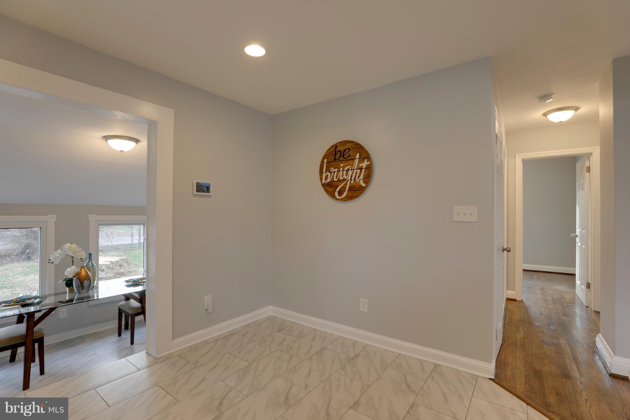 6203 Woodley Road Clinton, MD 20735 - Photo 7 of 38 a view of room with furniture and wooden floor