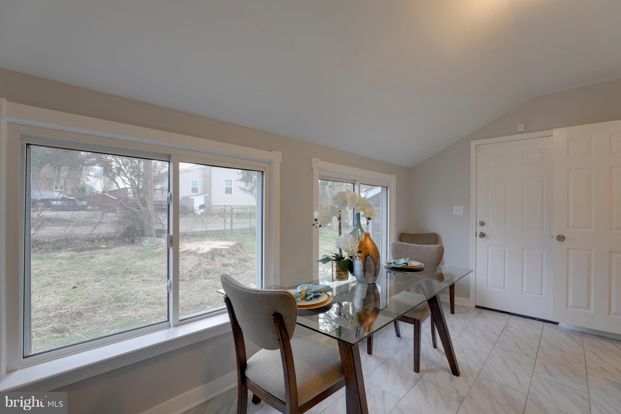 6203 Woodley Road Clinton, MD 20735 - Photo 8 of 38 a dining room with furniture and wooden floor