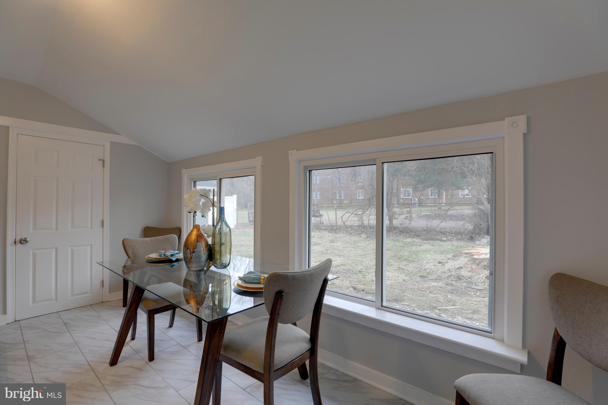 6203 Woodley Road Clinton, MD 20735 - Photo 9 of 38 a workspace with furniture and a window