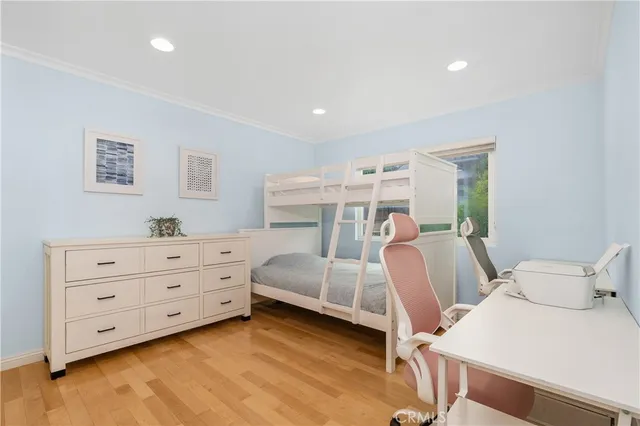 a bedroom with a bed and a table