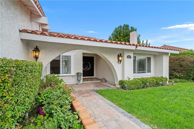 a view of a house with a garden