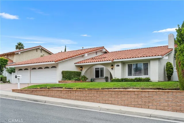 a view of a house with a street