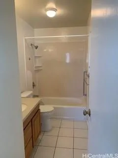 a bathroom with a sink vanity and a toilet