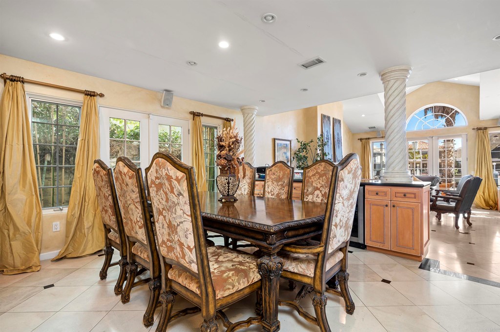 42 Blue Anchor Cay Road Coronado, CA 92118 - Photo 11 of 38 a view of a dining room with furniture and chandelier