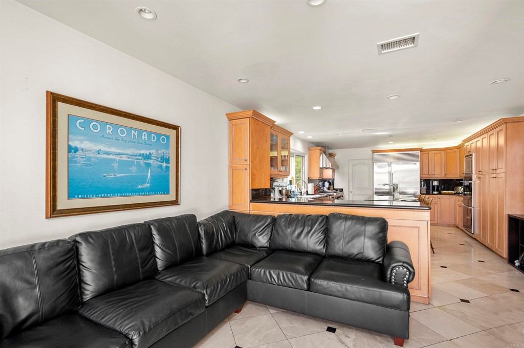 42 Blue Anchor Cay Road Coronado, CA 92118 - Photo 17 of 38 a view of living room kitchen with a couch and a view of kitchen
