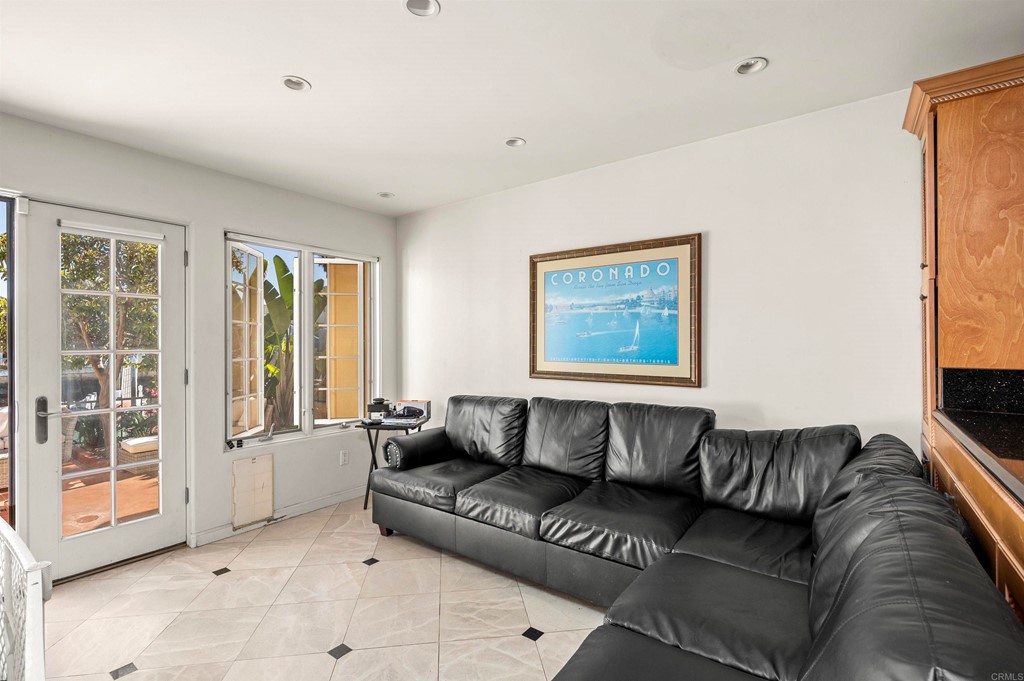42 Blue Anchor Cay Road Coronado, CA 92118 - Photo 18 of 38 a living room with a couch and a window
