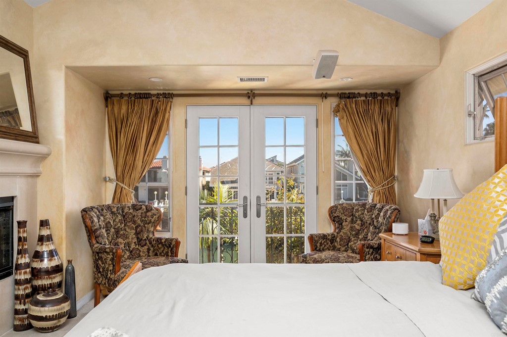 42 Blue Anchor Cay Road Coronado, CA 92118 - Photo 21 of 38 a bedroom with furniture and a window