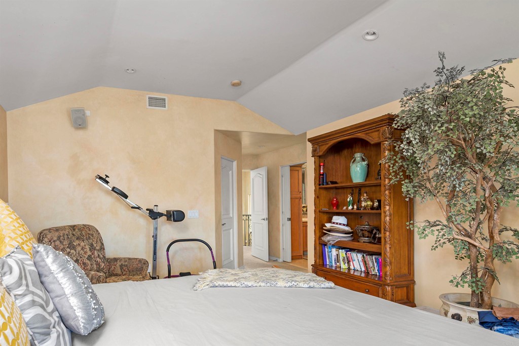 42 Blue Anchor Cay Road Coronado, CA 92118 - Photo 22 of 38 a bedroom with a bed and a large mirror on the dresser