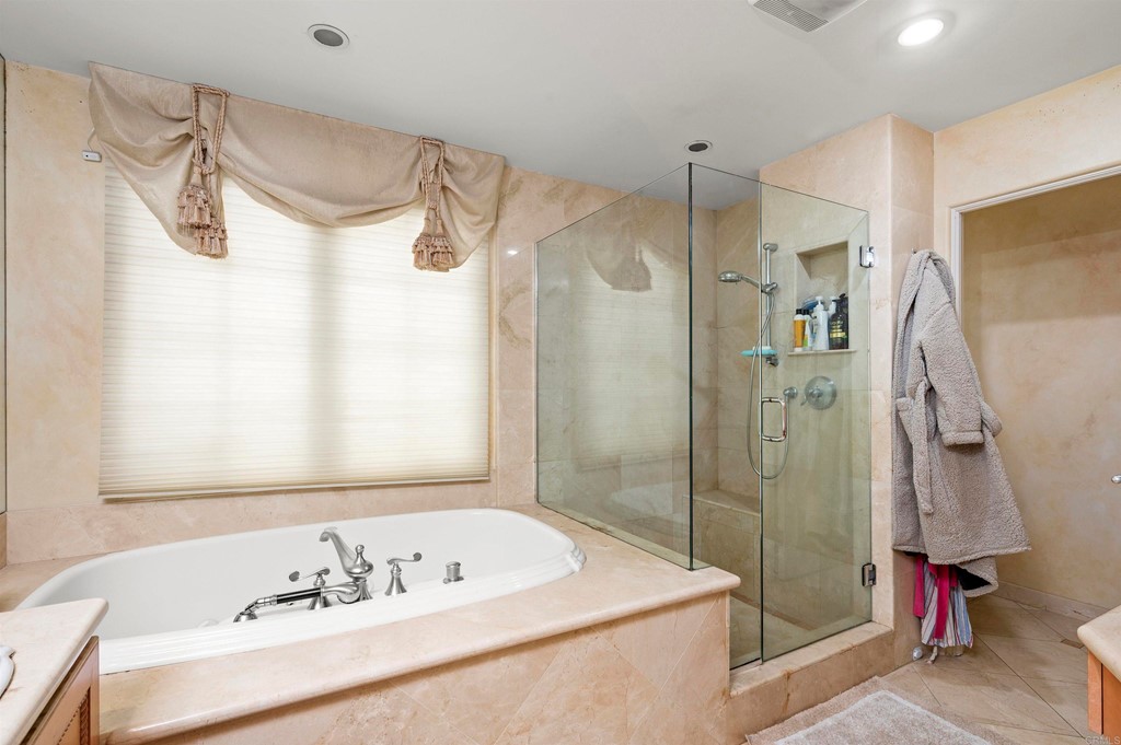 42 Blue Anchor Cay Road Coronado, CA 92118 - Photo 24 of 38 a bathroom with a sink a mirror and a shower