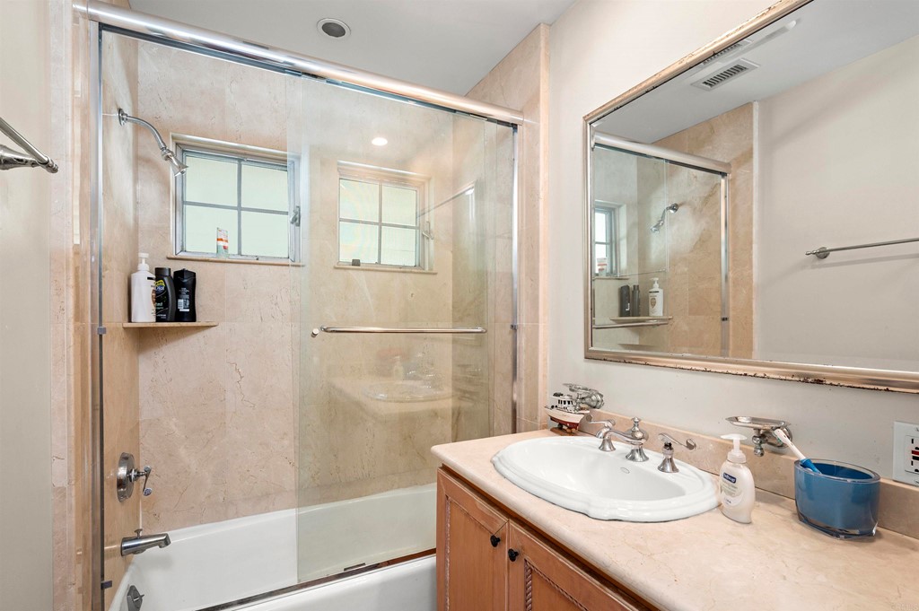 42 Blue Anchor Cay Road Coronado, CA 92118 - Photo 26 of 38 a bathroom with a sink mirror vanity and shower