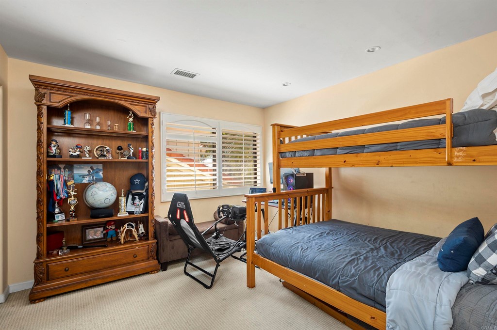 42 Blue Anchor Cay Road Coronado, CA 92118 - Photo 27 of 38 a bedroom with a bed and a window