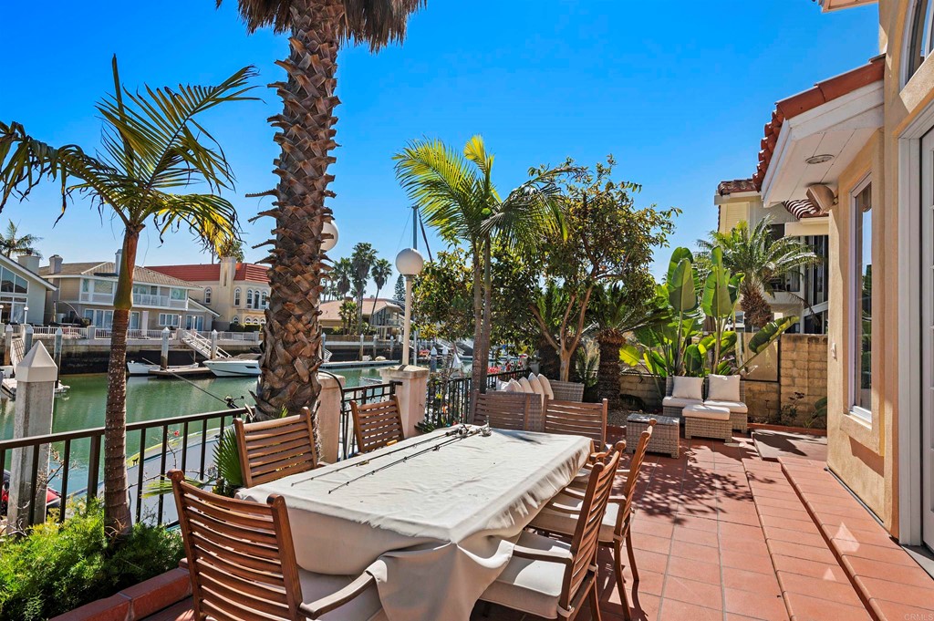 42 Blue Anchor Cay Road Coronado, CA 92118 - Photo 32 of 38 a view of a patio with table and chairs and potted plants