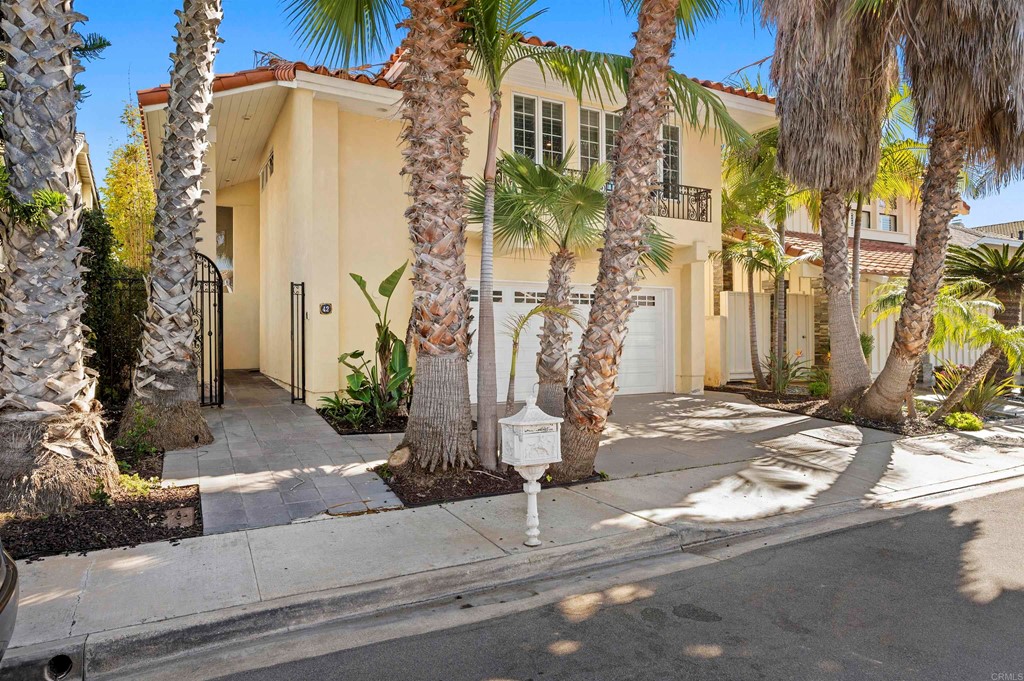 42 Blue Anchor Cay Road Coronado, CA 92118 - Photo 4 of 38 a view of a brick building next to a yard