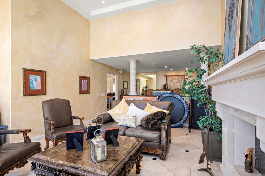 42 Blue Anchor Cay Road Coronado, CA 92118 - Photo 10 of 38 a living room with furniture a dining table and a potted plant