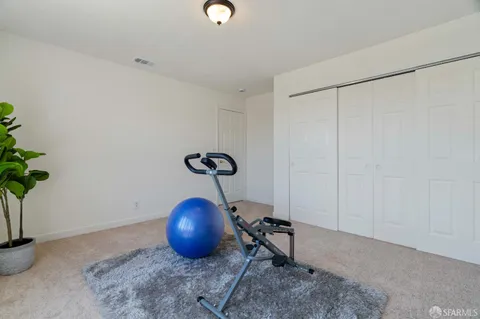 a room with a table and a potted plant