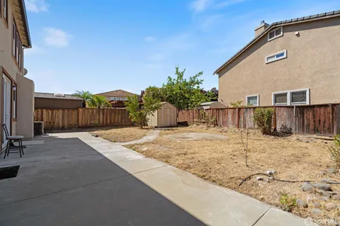 a view of a backyard of the house