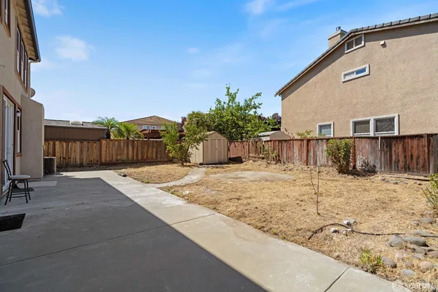 a view of a backyard of the house
