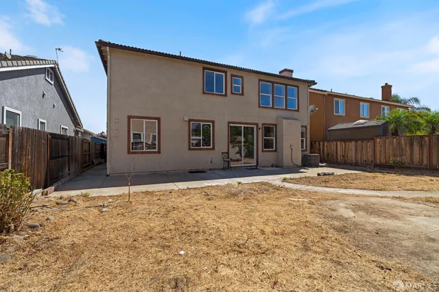 a house with tree in front of it