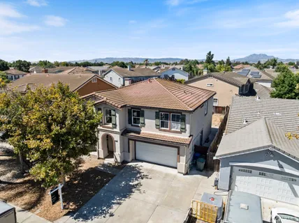 an aerial view of a house with a ocean view
