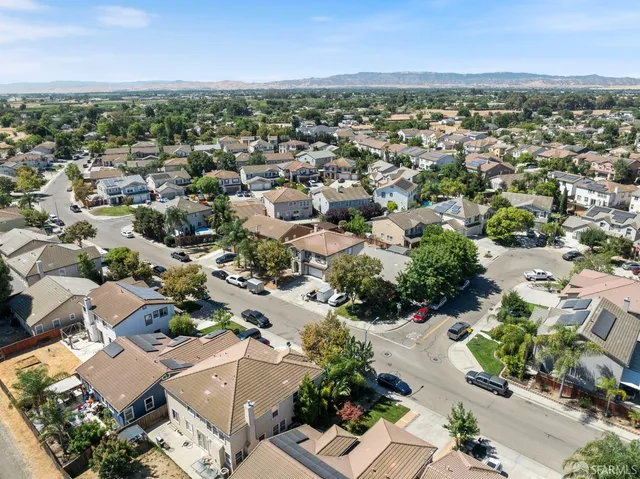 an aerial view of residential houses with outdoor space