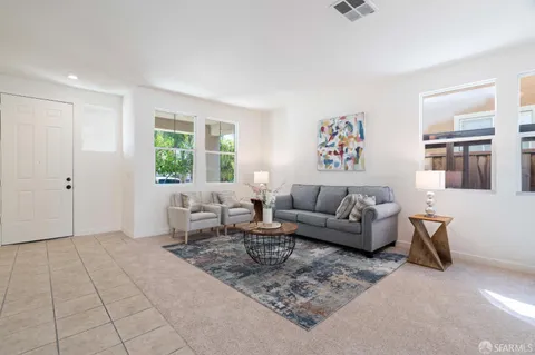 a living room with furniture and window