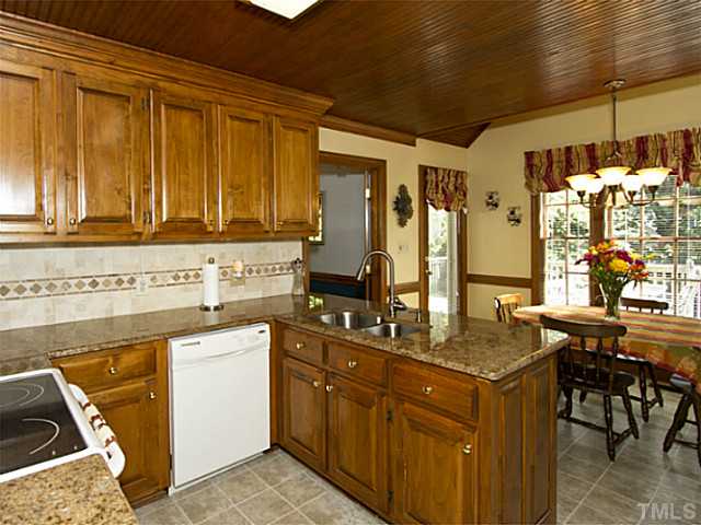 2812 Halfhitch Trail Raleigh, NC 27615 - Photo 8 of 23 Kitchen overlooks breakfast area. Door to the left leads to the deck.