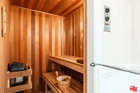 a close view of a door and chair in the balcony