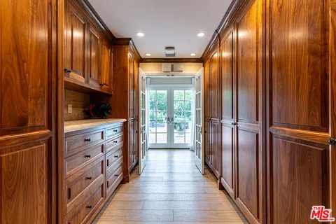 a bathroom with a granite countertop sink a toilet a mirror and shower