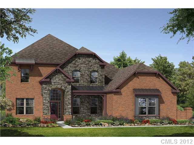 9006 Rochedale Place, Unit 73 Waxhaw, NC 28173 - Photo 1 of 4 a front view of a house with garden