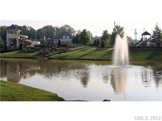 9006 Rochedale Place, Unit 73 Waxhaw, NC 28173 - Photo 2 of 4 a view of a lake with houses