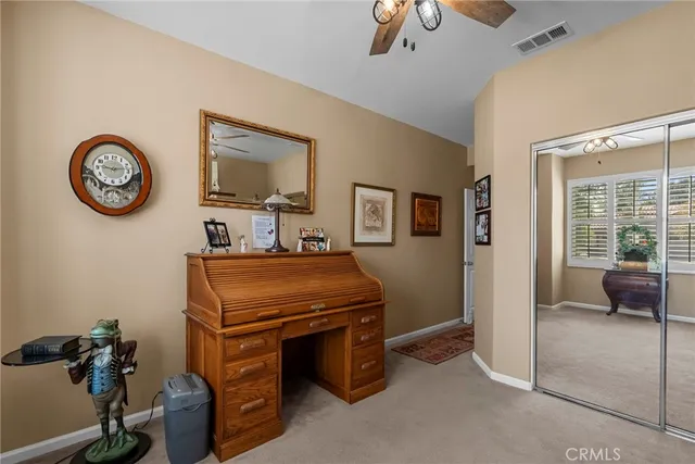 a kitchen with stainless steel appliances kitchen island granite countertop a refrigerator a stove a sink and a dining table with wooden floor