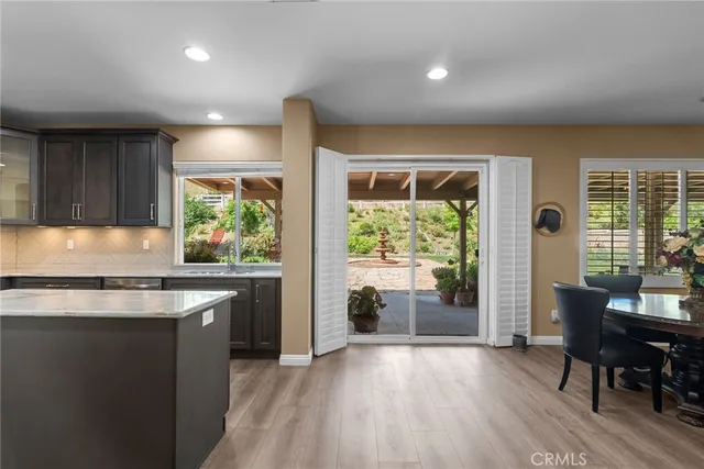 a view of a dining room with furniture and window