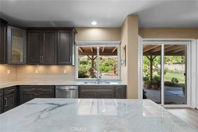 a view of a hallway and a livingroom with furniture