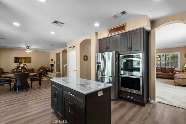 a bedroom with a bed a couch and a window