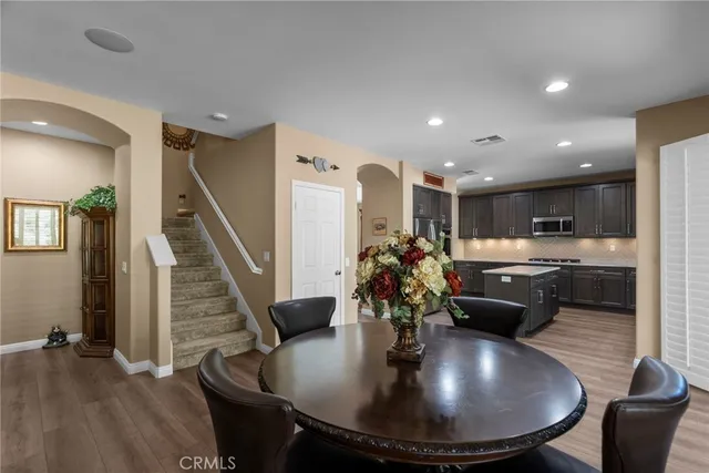 a bathroom with a double vanity sink mirror and a bathtub