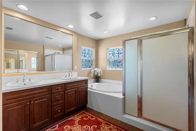 a living room filled with furniture and a potted plant