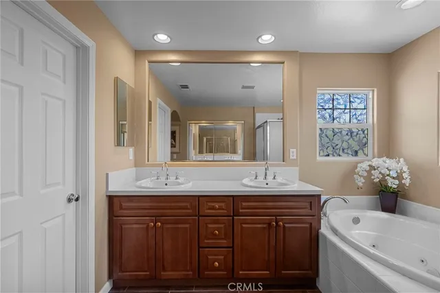 a garden view with a seating space and potted plants