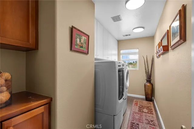 a view of a patio with table and chairs potted plants