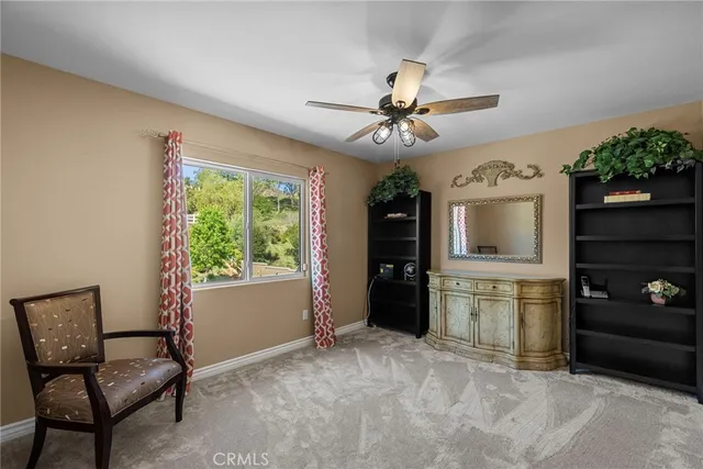 a front view of a house with swimming pool having outdoor seating