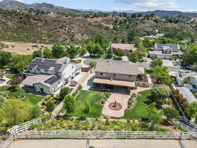 an aerial view of residential houses with outdoor space and parking space