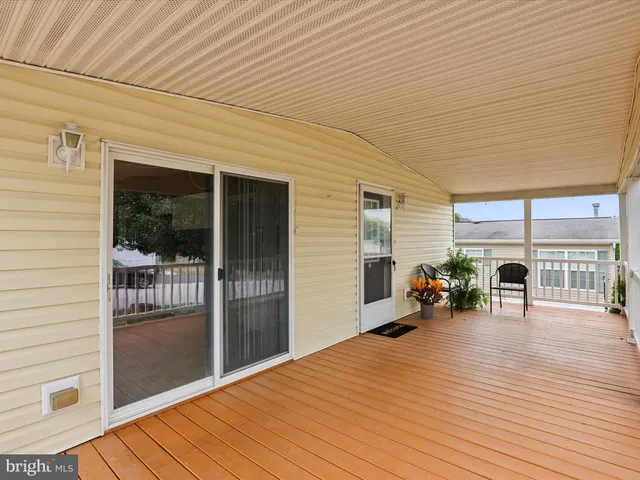 a view of a patio with wooden floor