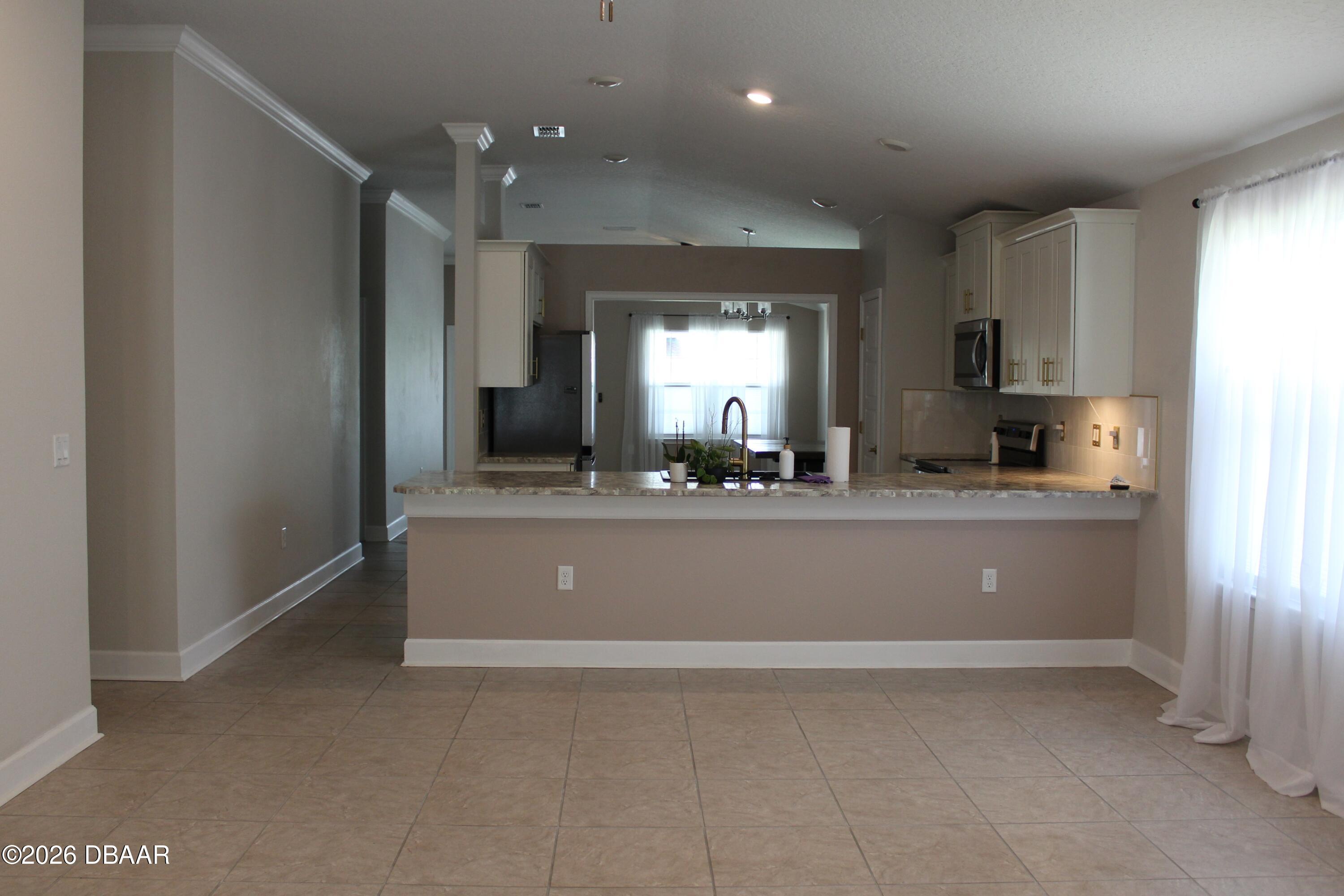25 Rivertown Road Palm Coast, FL 32137 - Photo 7 of 16 LR to Kitchen