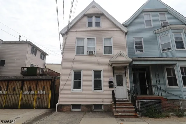 a front view of a house with glass windows